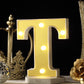 Warm white 3D marquee letter "T" with LED lights.