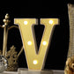 Gold 3D marquee letter "V" with warm white LED lights.