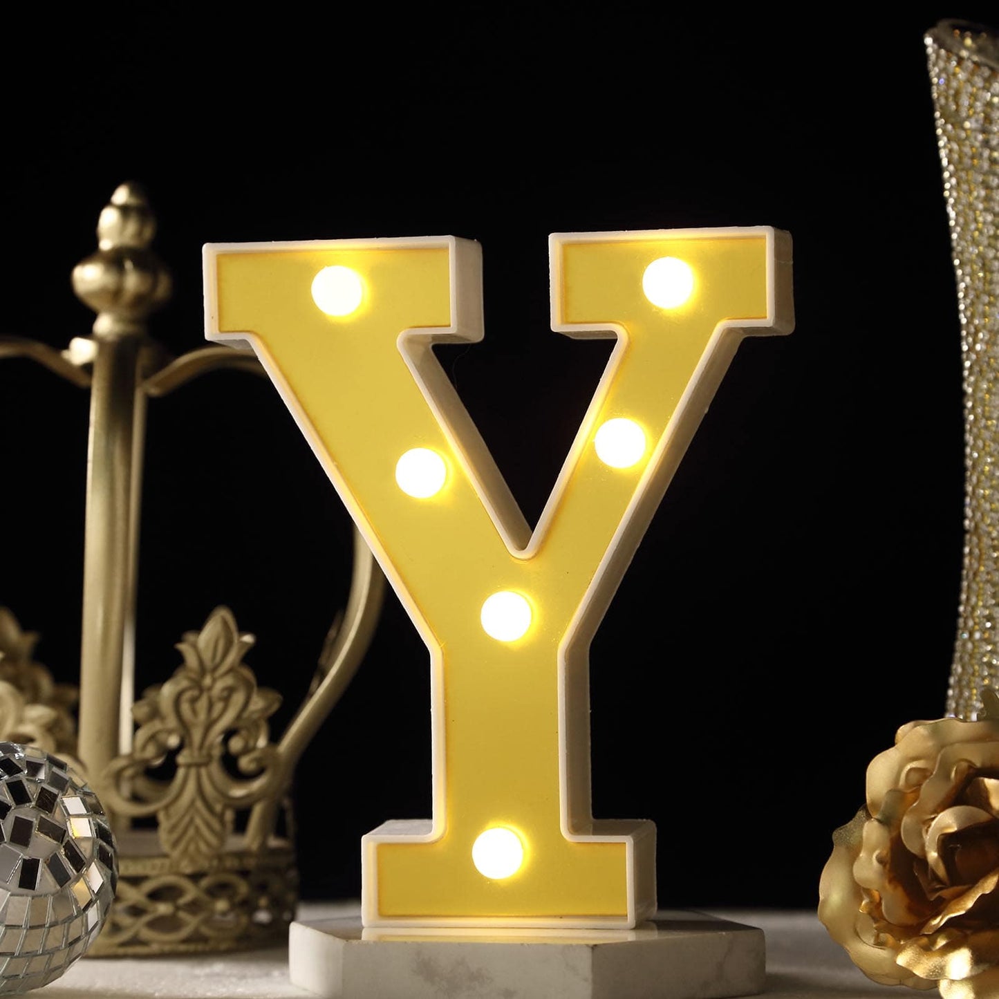 Gold 3D marquee letter "Y" with warm white LED lights.