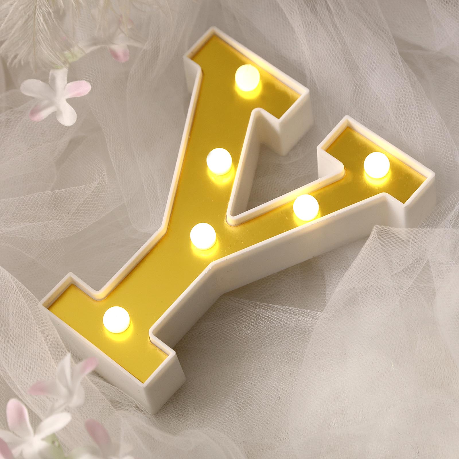 Gold 3D marquee letter "Y" with warm white LED lights.