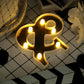 Gold 3D marquee ampersand symbol with warm white LED lights.