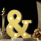 Warm white 3D marquee ampersand symbol with LED lights.