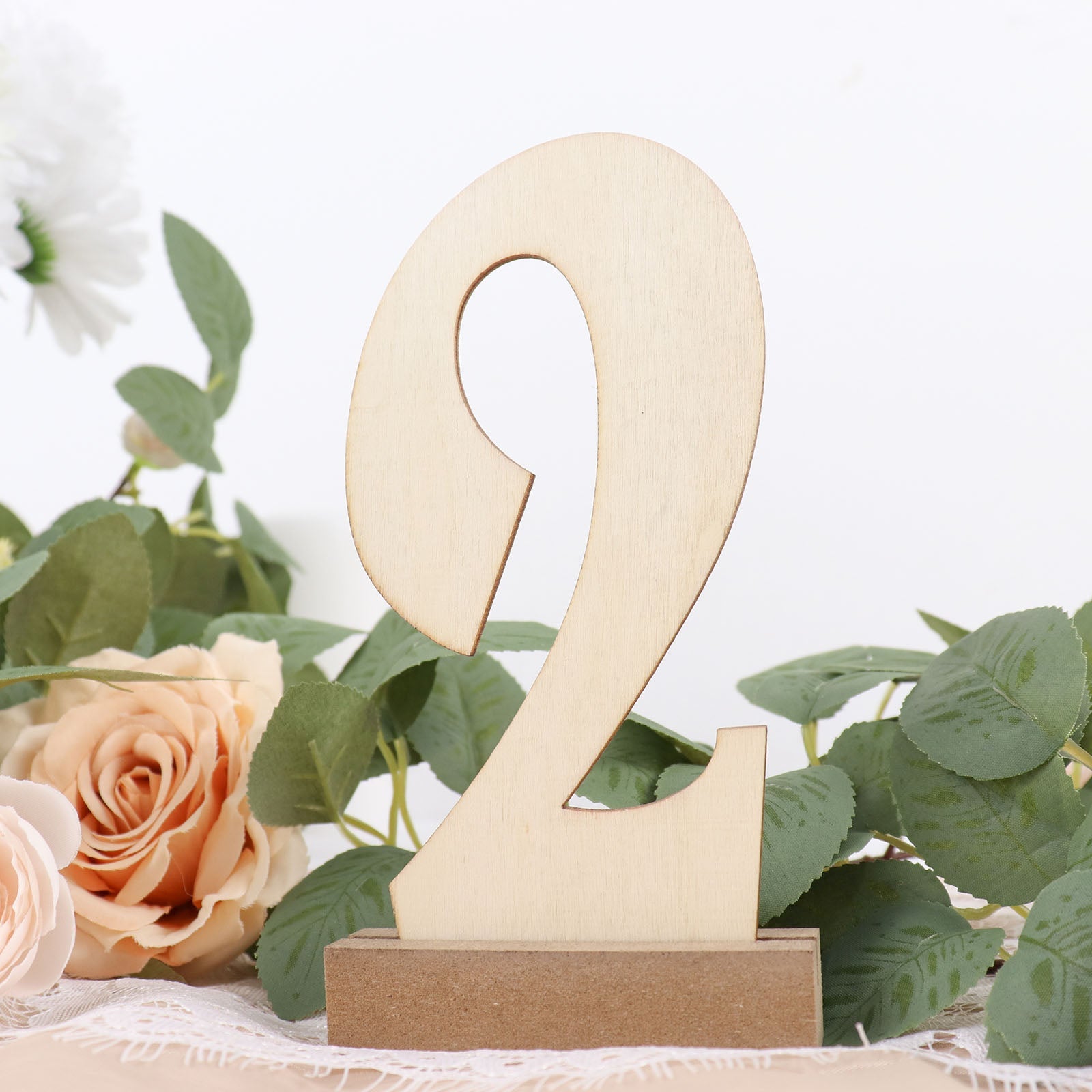 Natural wooden wedding table number "2" with holder base.