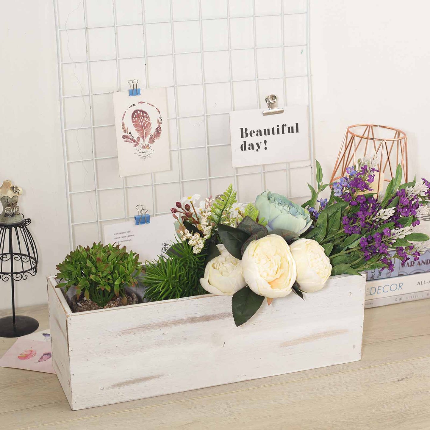 Whitewash rectangular wood planter box with flowers and greenery.