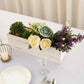 Whitewash rectangular wood planter box with flowers and greenery.