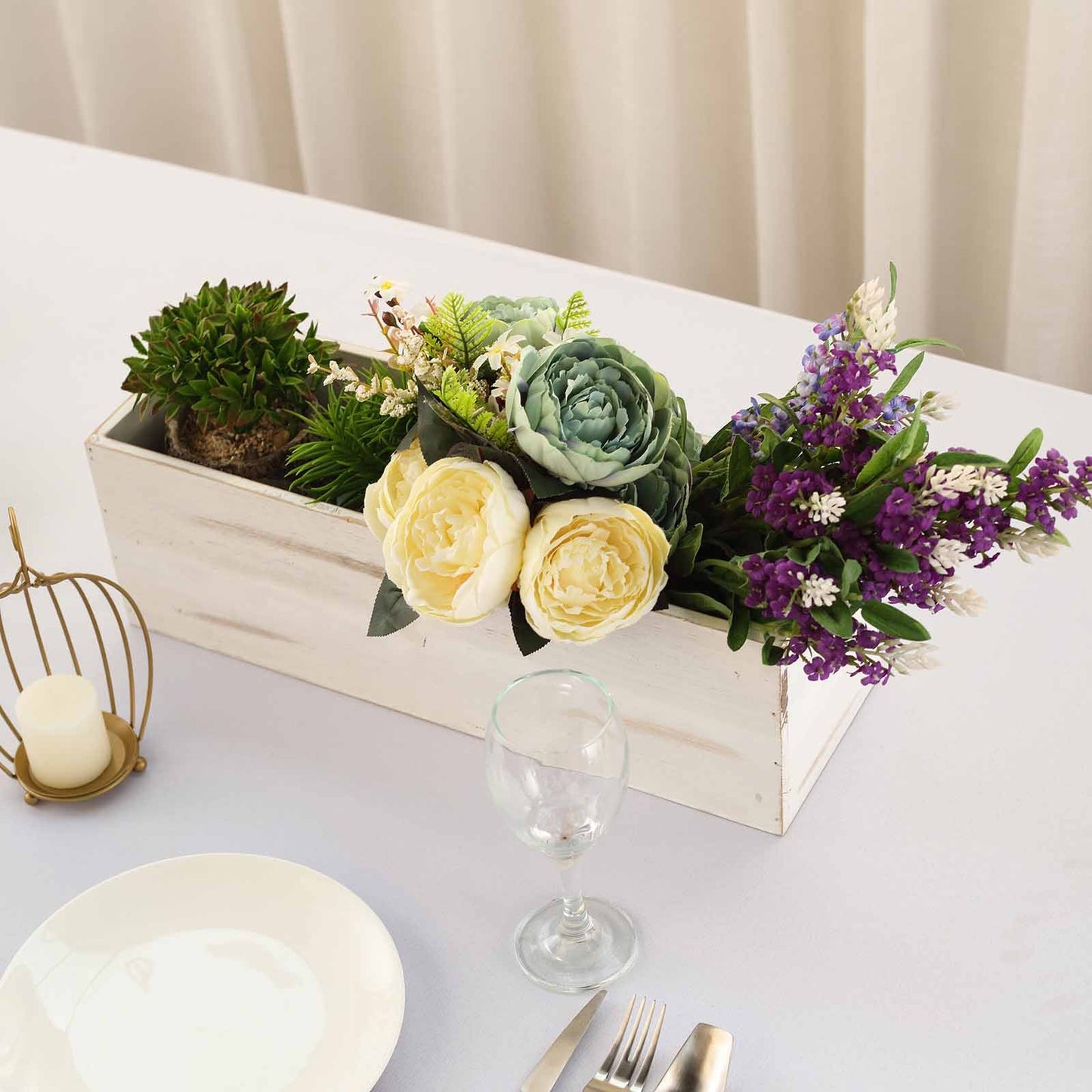 Whitewash rectangular wood planter box with flowers and greenery.