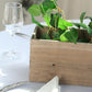 Natural rectangular wood planter box with removable plastic liners.