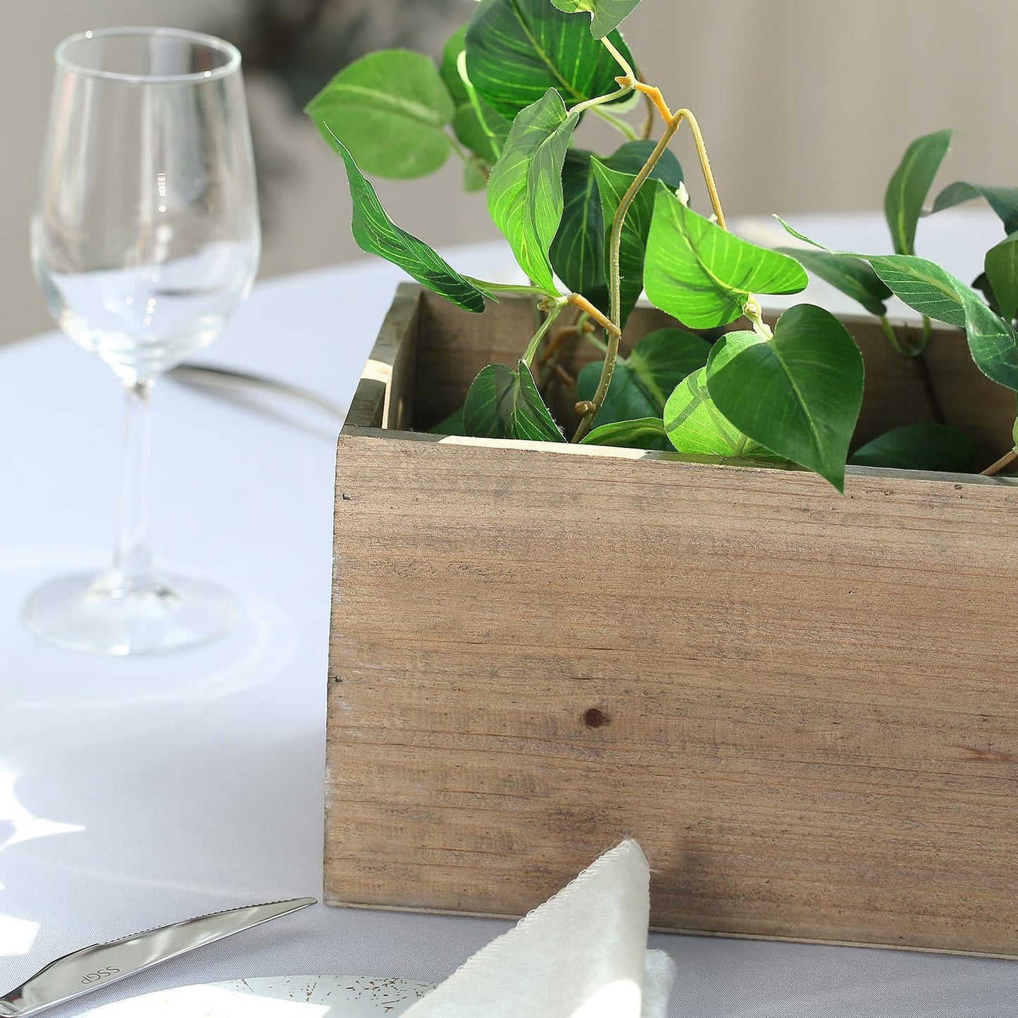 Natural rectangular wood planter box with removable plastic liners.