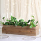 Natural wood planter box with removable plastic liners and greenery.