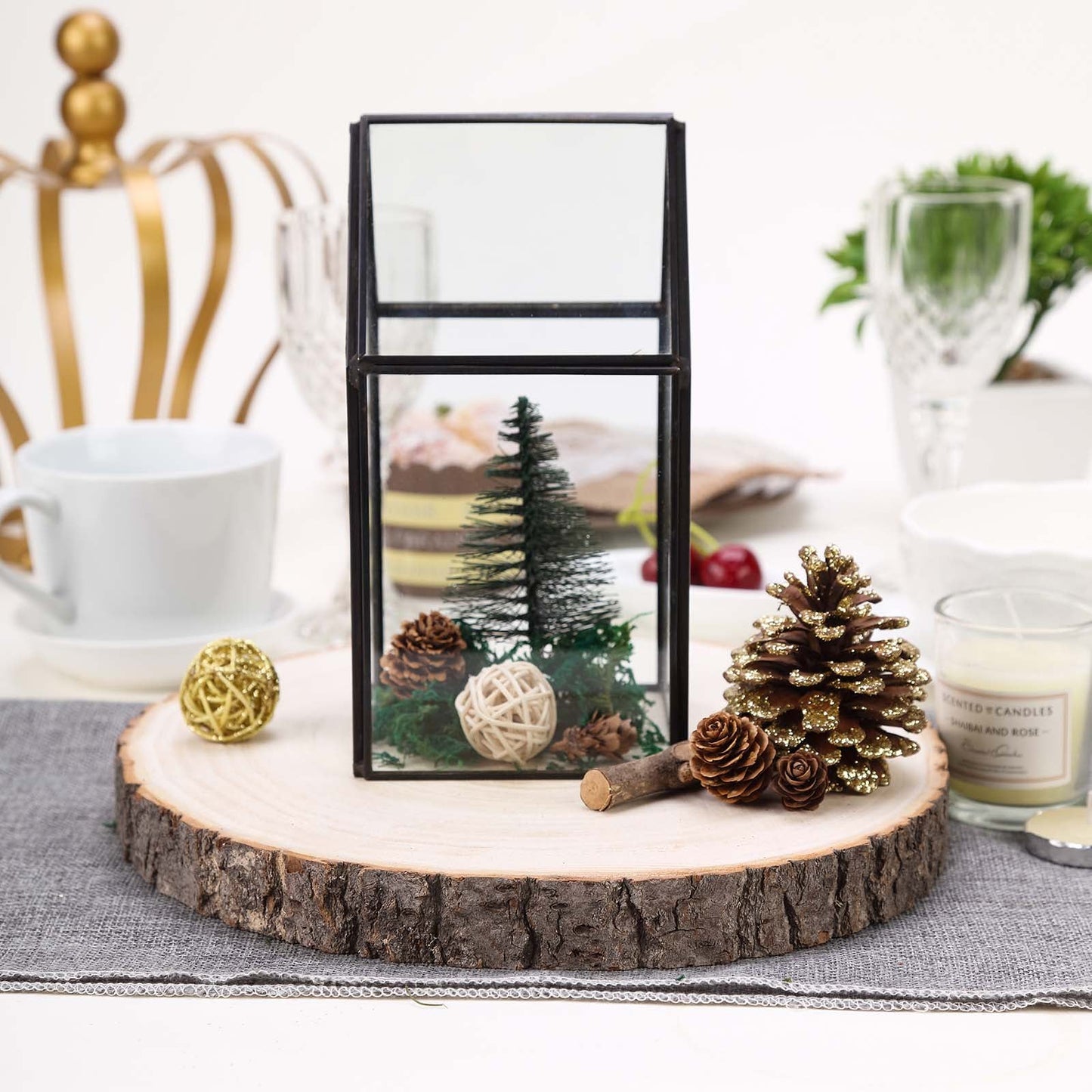 Natural wood slice centerpiece with rustic decor and greenery.