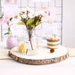 Natural color round rustic wood slice table centerpiece.